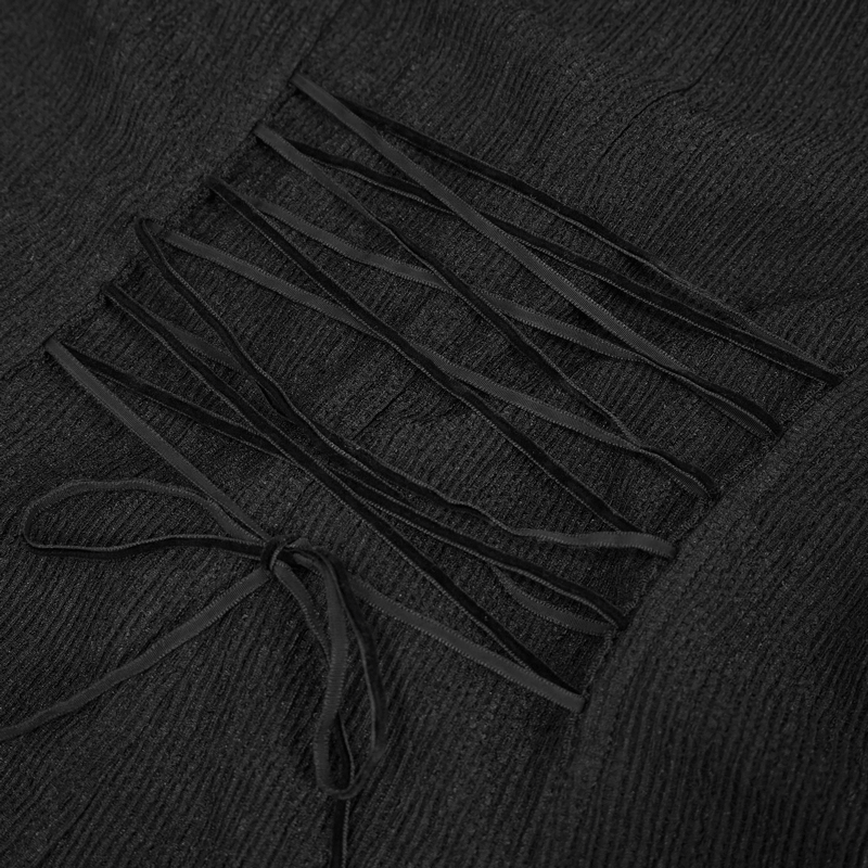 Close-up of the intricate appliquéd design and lace-up detail on a Gothic women's blouse.