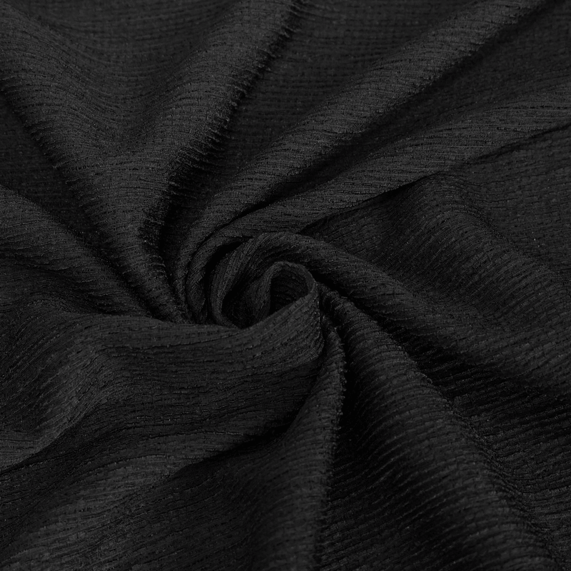 Close-up view of textured black fabric, perfect for gothic style clothing and elegant appliquéd blouses.
