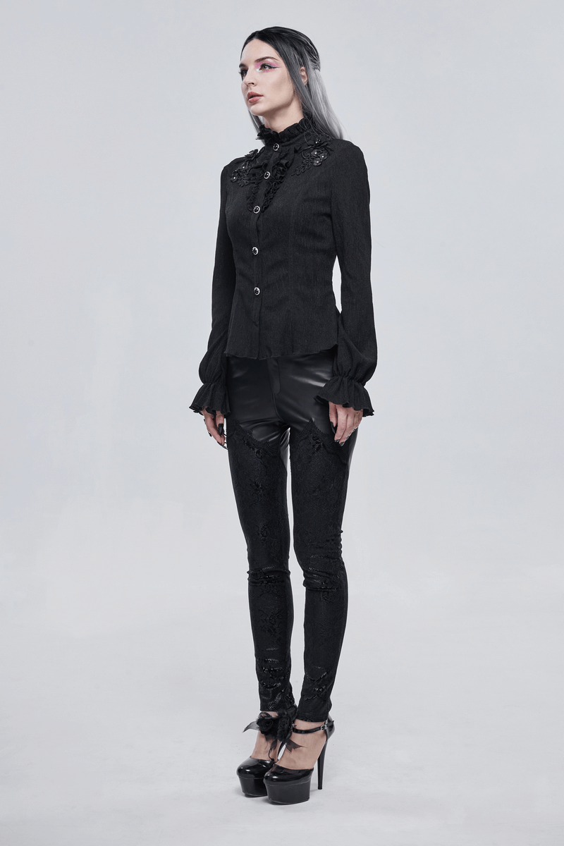 Woman in gothic stand collar shirt with buttons, stylish black blouse and leggings, showcasing elegant fashion.