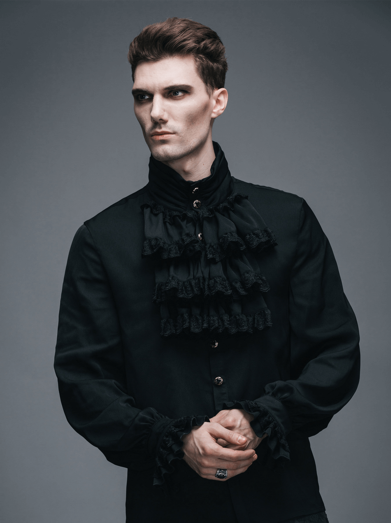 Gothic steampunk male model wearing a vintage black flounce tie shirt with ruffles and long sleeves.