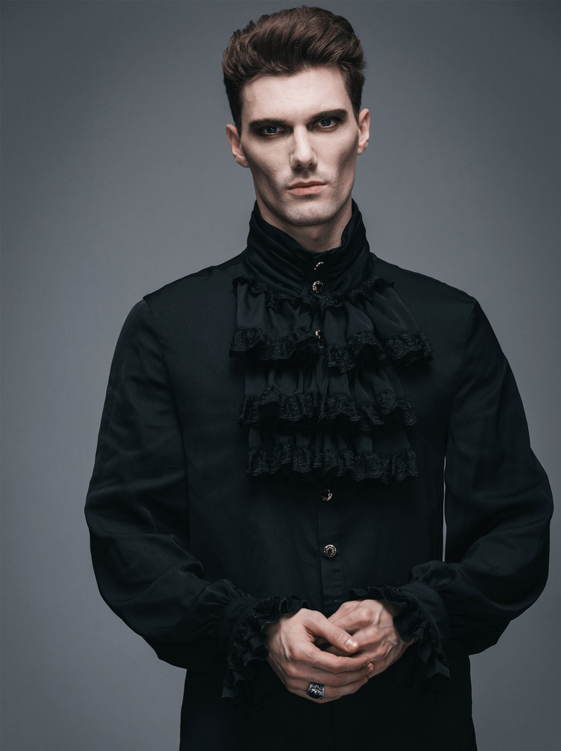 Gothic steampunk male model wearing a vintage black blouse with elegant ruffles and long sleeves.