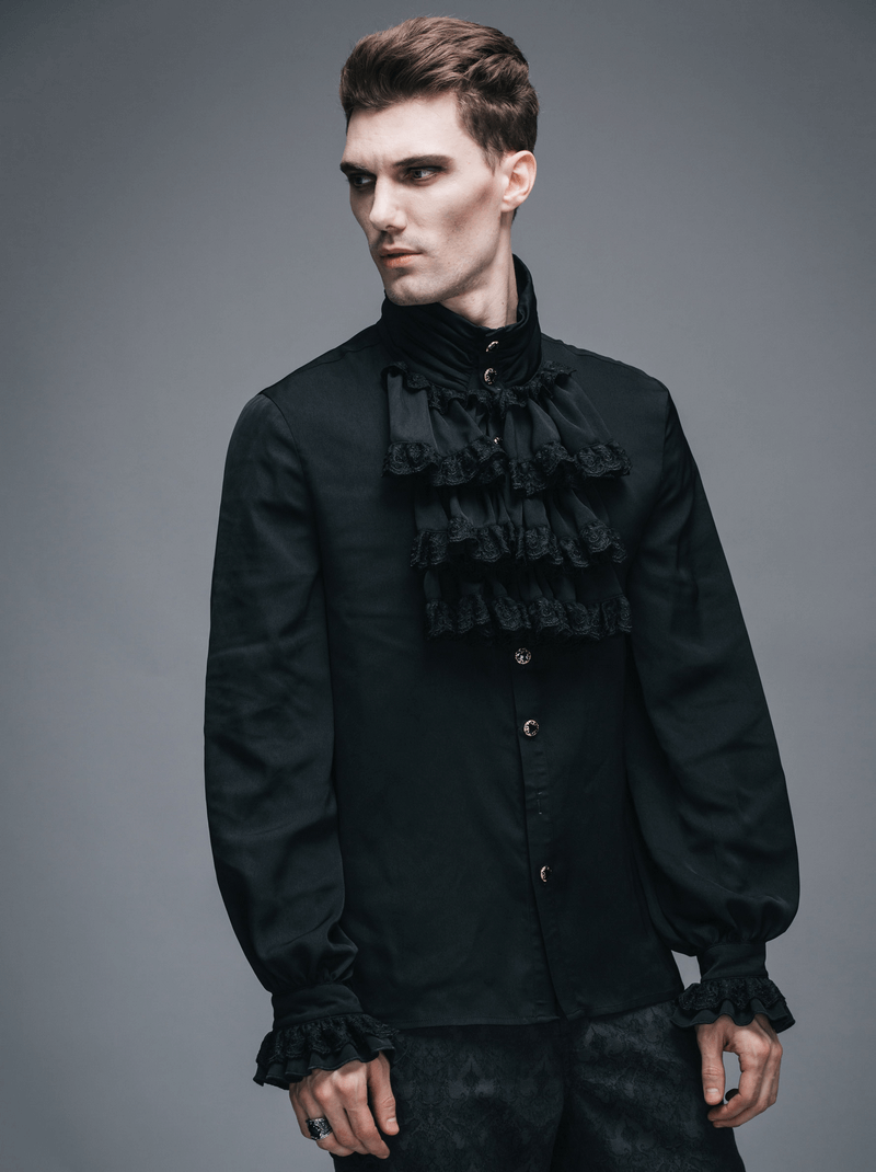 Gothic steampunk male wearing a vintage black flounce tie shirt with ruffles and long sleeves.