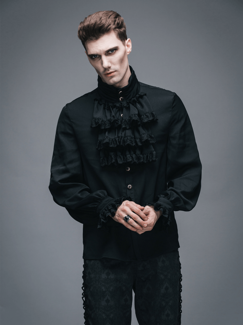 Gothic steampunk male model wearing a vintage black long sleeve tie shirt with ruffles and elegant details.