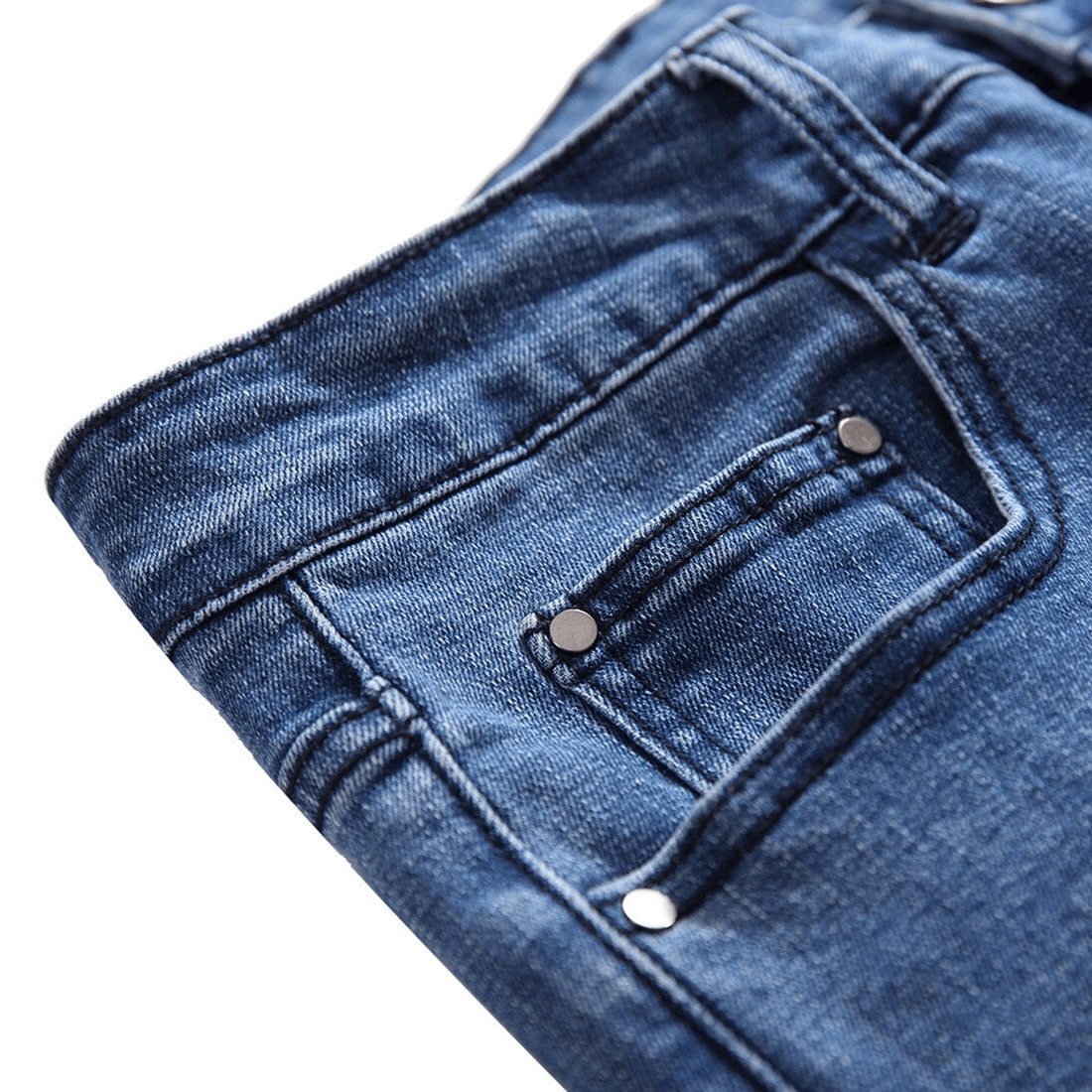 Close-up of Gothic straight cut blue denim jeans showcasing pocket details and stitching patterns.