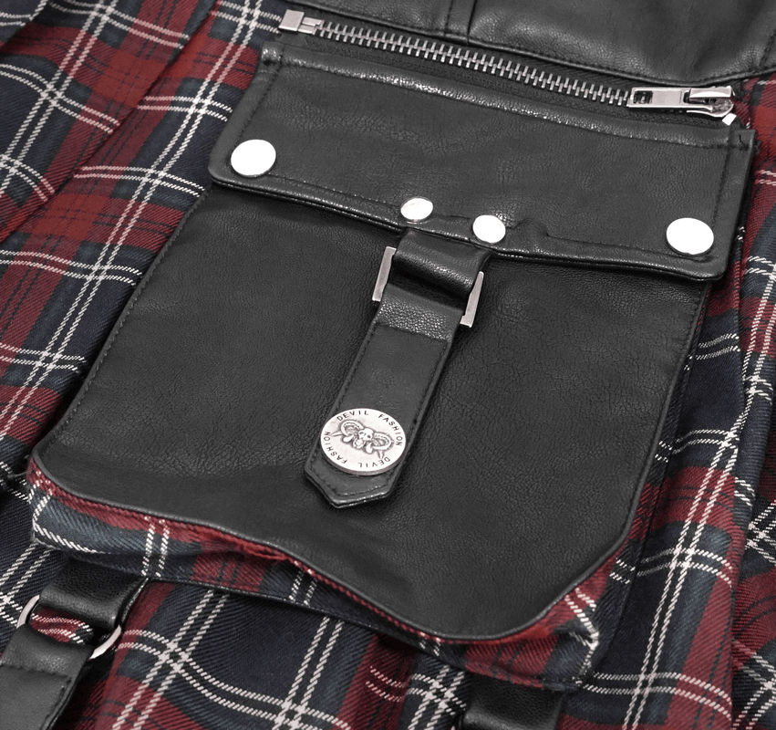 Close-up of the gothic plaid skirt showing leather detail, silver snaps, and stylish zipper pocket design.