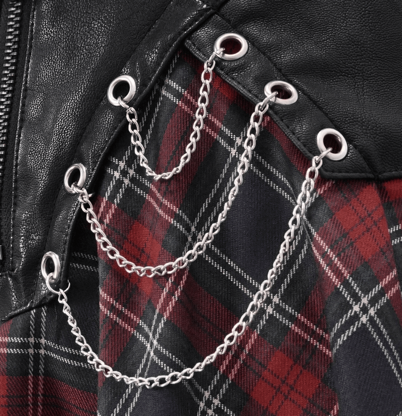 Close-up of chains and grommets on a gothic plaid skirt, showcasing punk style and trendy design elements.