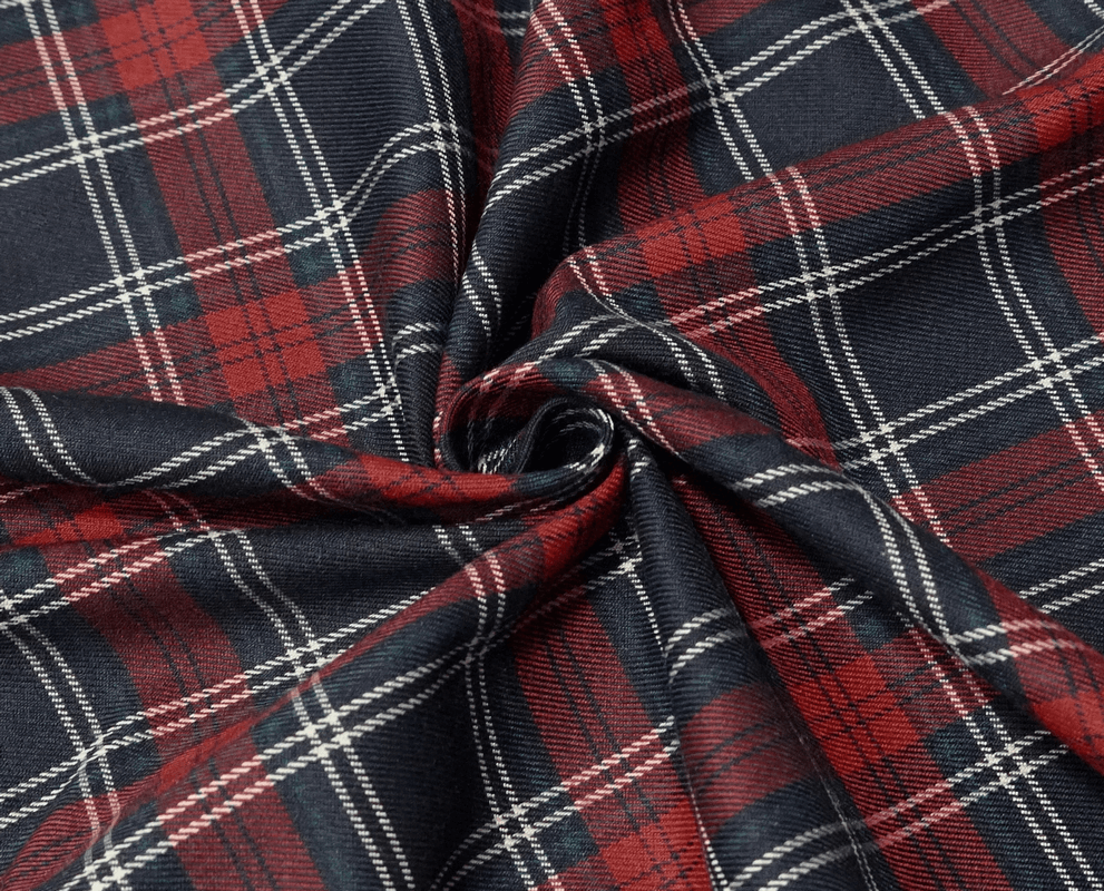 Close-up of trendy plaid fabric in red and navy blue, perfect for an edgy punk mini skirt.