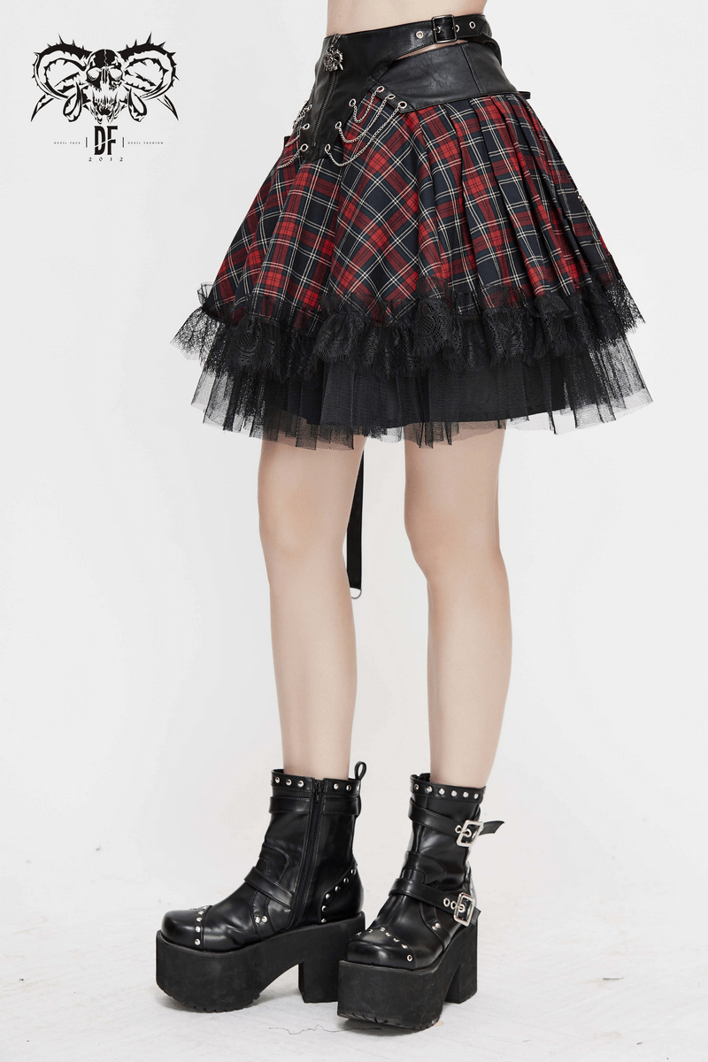 Gothic strappy plaid mini skirt with chains and lace, paired with stylish black platform boots.