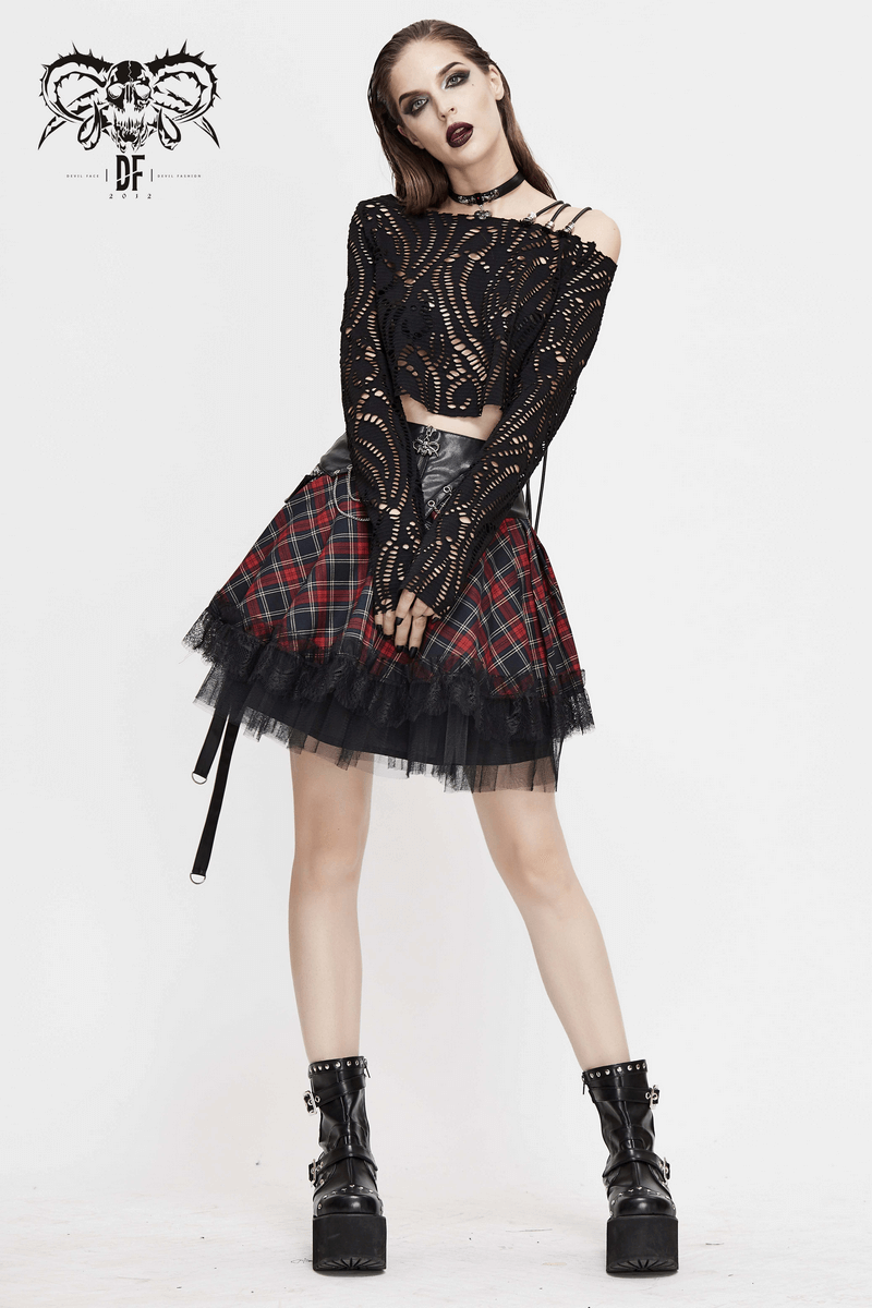 Alternative fashion model showcasing a gothic strappy plaid mini skirt with lace and chains, paired with edgy black top.