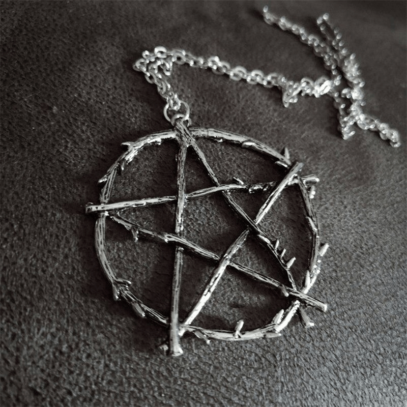 Gothic style necklace with branch pentagram pendant on a silver chain, perfect for alternative fashion enthusiasts.