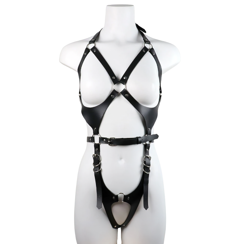 Stylish gothic female body harness made of black leather with silver fittings for a bold fashion statement.