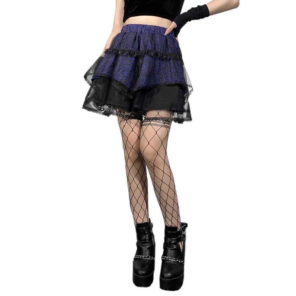 Gothic style women's short skirt with lace insert, paired with fishnet stockings and platform shoes.