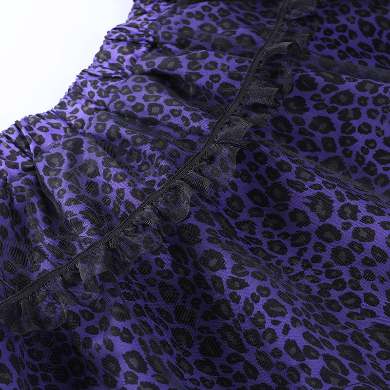 Close-up of a purple leopard print fabric skirt with lace detailing, showcasing a trendy gothic style.
