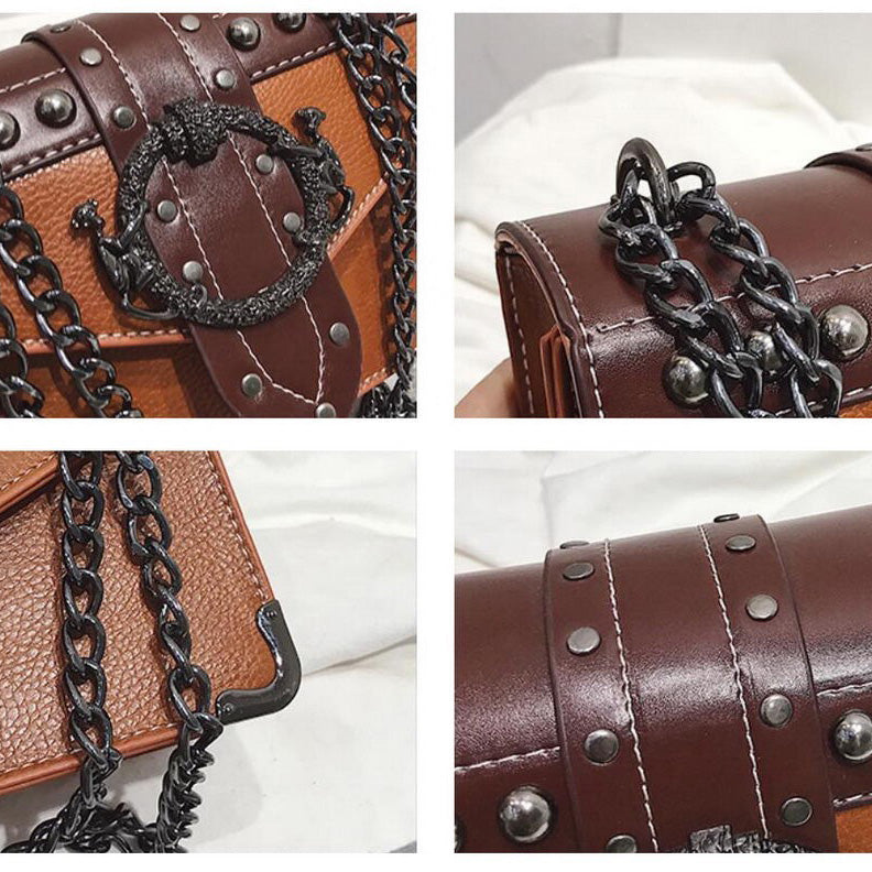 Close-up of gothic style women's square bag featuring metal chains and skull rivets, showcasing unique design details.