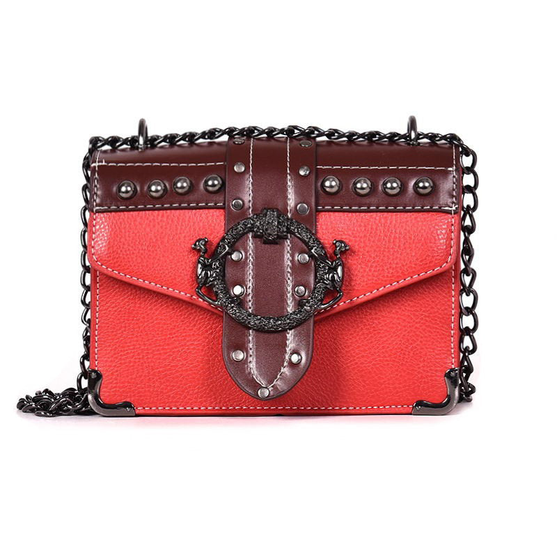 Gothic style women's square handbag with rivet details and metal chain strap in red and brown.