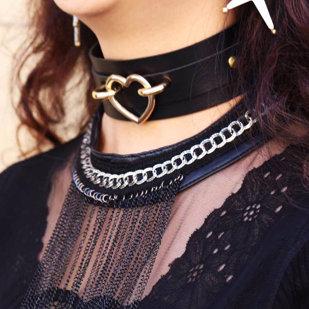 Gothic heart choker necklace worn with layered chains, perfect goth jewelry for women and witchy outfits.