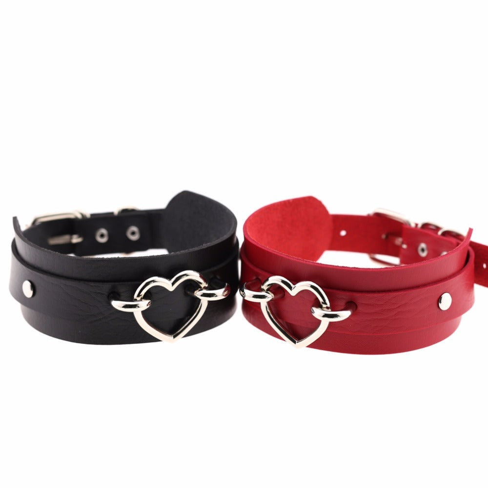 Gothic heart choker necklaces in black and red leather, perfect for adding a cute touch to witch clothing.