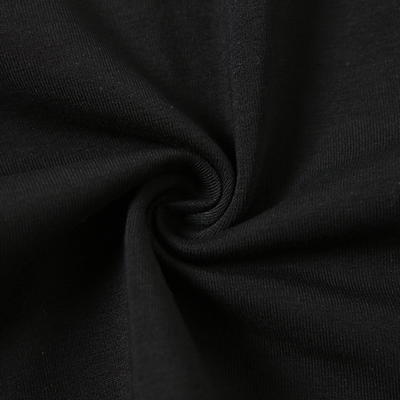 Close-up of soft black fabric, ideal for a gothic style crop top, showcasing quality material for comfort and style.