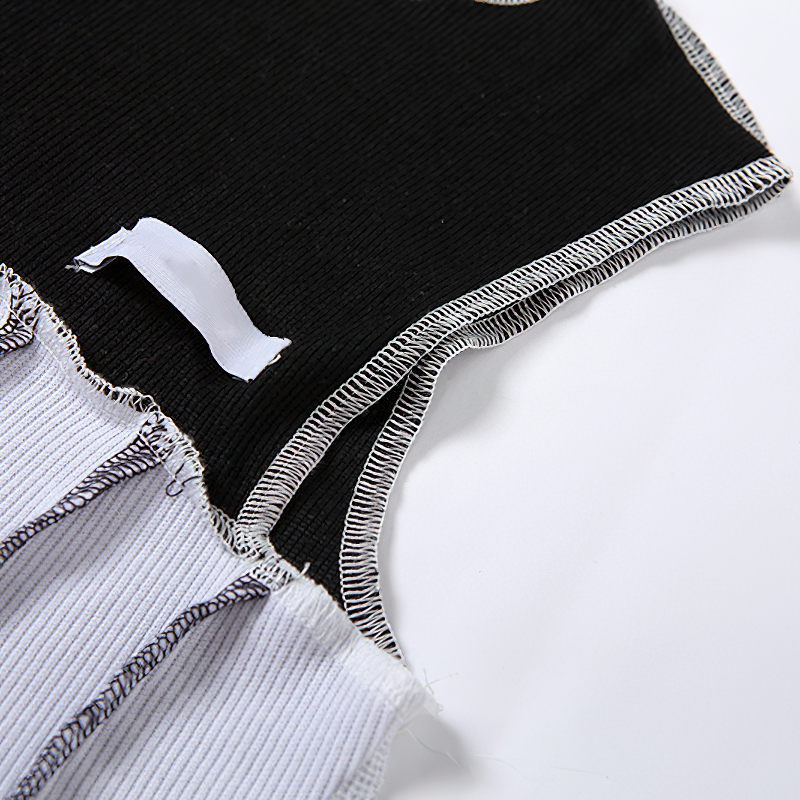 Close-up of the Gothic Style Hollow Out Sleeve Crop Top showing black and white fabric details.
