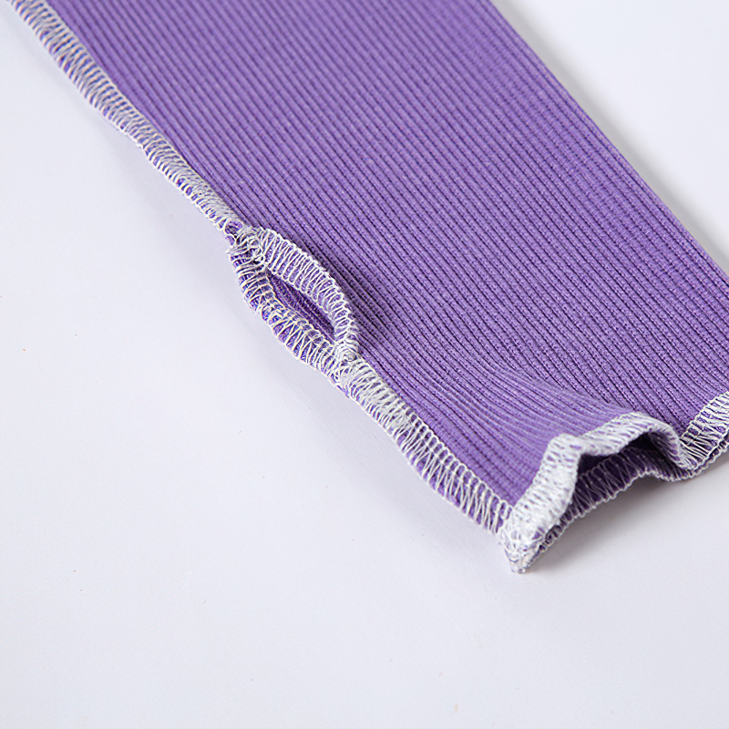 Close-up of the purple hollow out sleeve of a Gothic style crop top, showcasing unique ribbed texture and contrasting stitching.