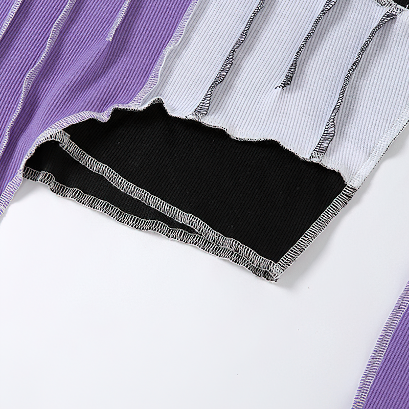 Close-up of Gothic style hollow out sleeve crop top in purple, black, and white colors, showcasing its unique fabric design.