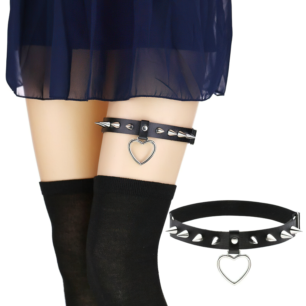 Gothic style leg garter belt with silver spikes and heart pendant, perfect for adding edgy flair to any outfit.