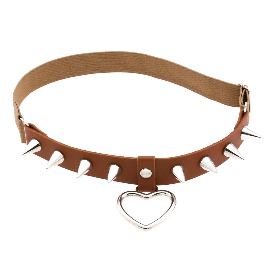 Gothic style leg garter belt with silver spikes and heart pendant, perfect for edgy women's fashion.