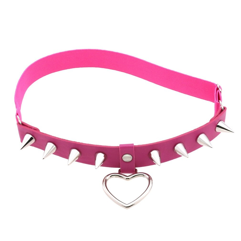 Pink gothic choker with silver spikes and heart pendant, perfect for edgy fashion lovers.