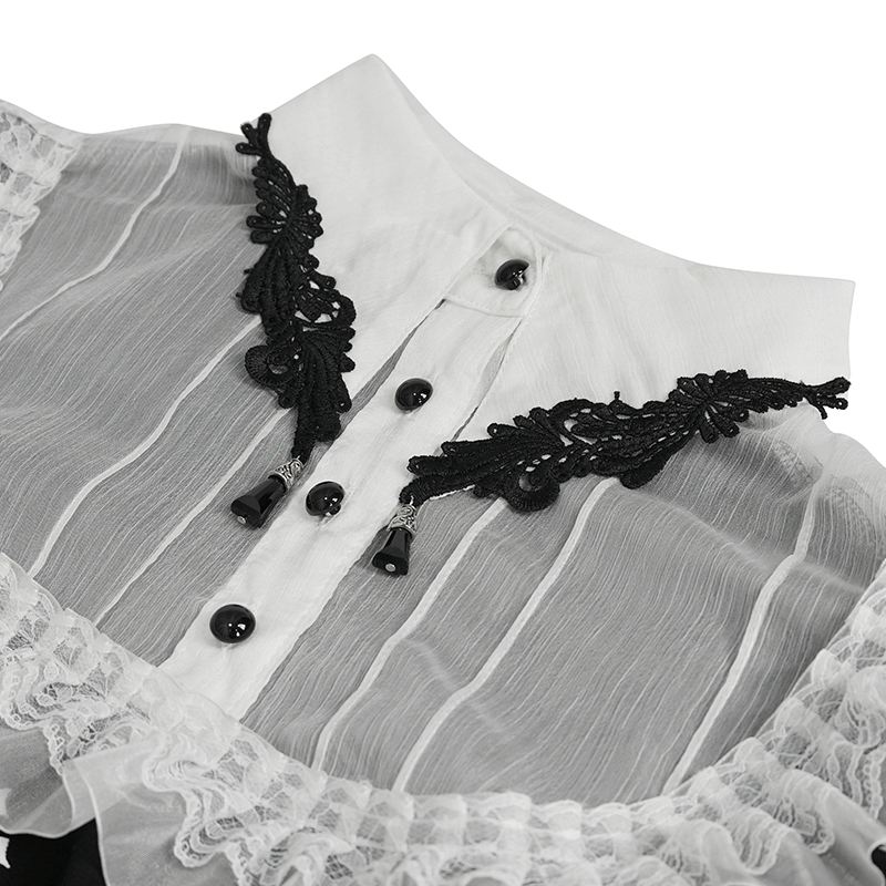Close-up of a Gothic style blouse featuring intricate black lace and buttons on a soft, sheer white fabric.