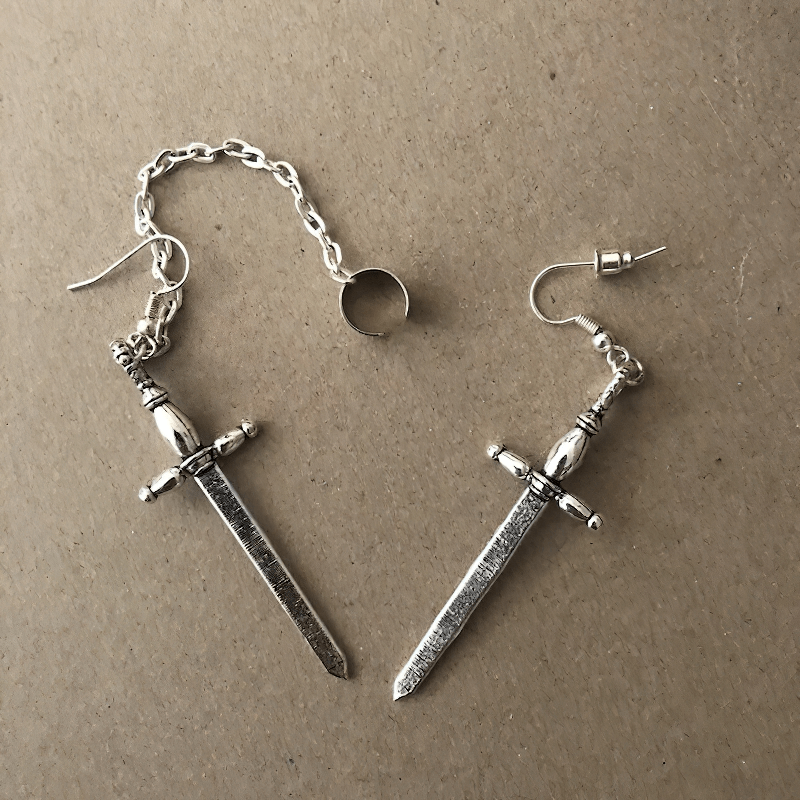 Gothic style sword earrings with chain, perfect punk accessory for women, stylish and eye-catching.