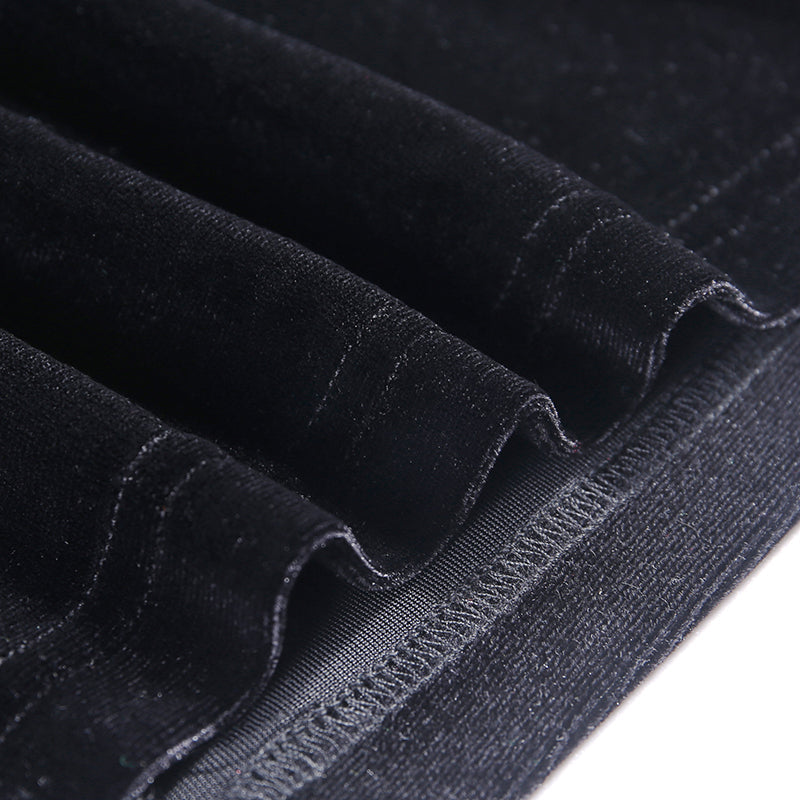 Close-up of luxurious black velvet fabric showcasing the soft texture perfect for gothic style fashion dresses.