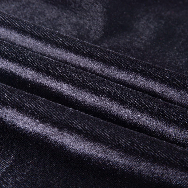 Close-up of soft black velvet fabric, showcasing texture for gothic style dresses in alternative fashion.