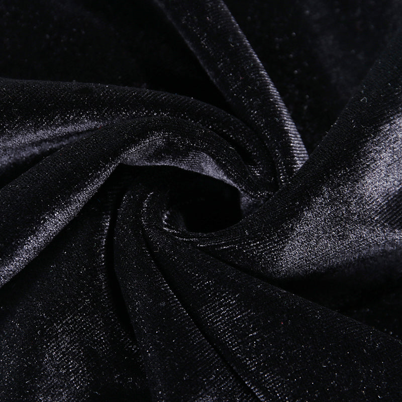 Close-up of black velvet fabric, showcasing the luxurious texture for a gothic style dress.