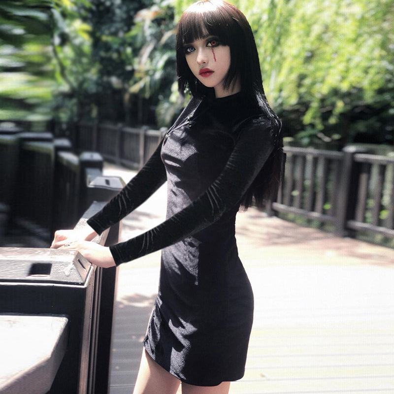 Gothic style velvet mini dress for women with mandarin collar in an outdoor setting.