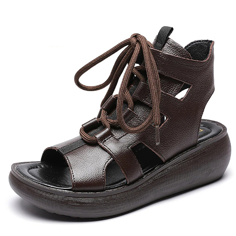 Gothic style women's genuine leather sandals with lace-up design and comfortable wedge sole in dark brown.