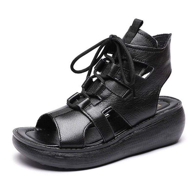Gothic style women's black genuine leather sandals with lace-up design and comfortable platform sole.