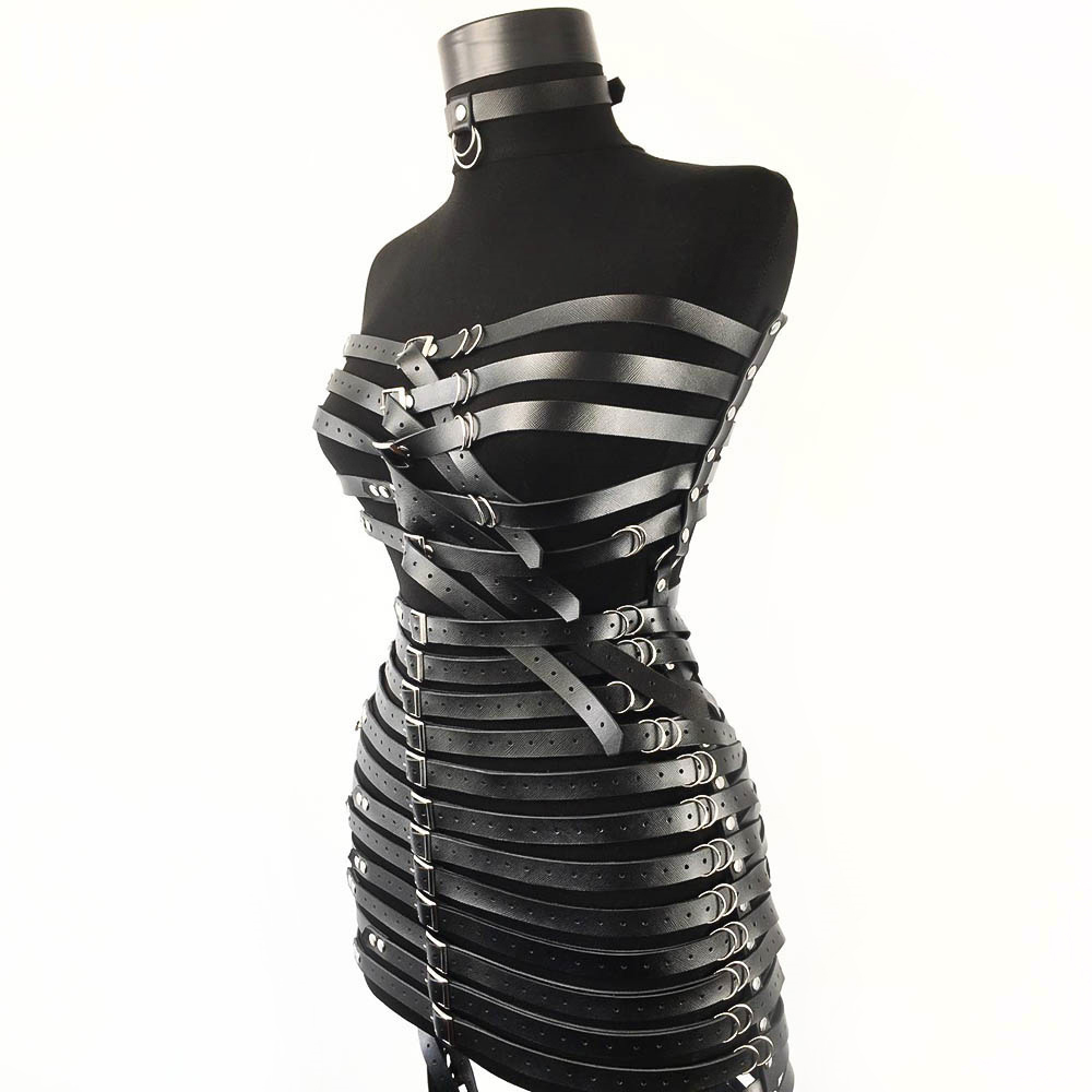 Gothic style women's PU leather harness dress with silver fittings showcasing bold bondage aesthetics.