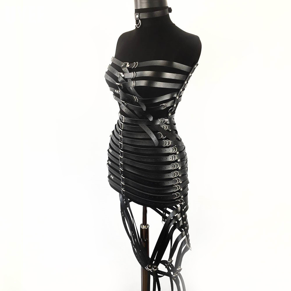 Gothic style women's PU leather harness dress with silver fittings on black mannequin.