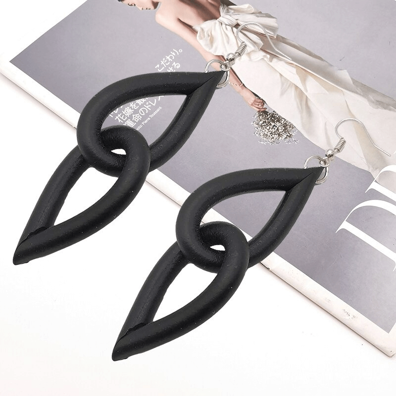 Gothic handmade black rubber earrings featuring a stylish loop design, perfect for women's accessories.