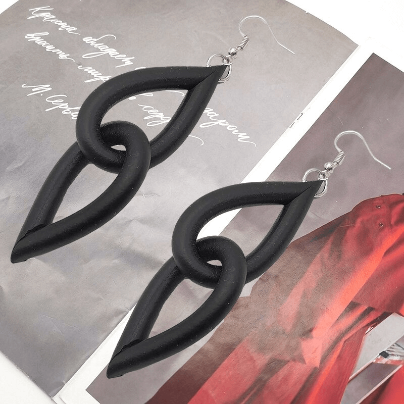 Handmade gothic black rubber earrings featuring a stylish loop design, perfect for women's accessories.