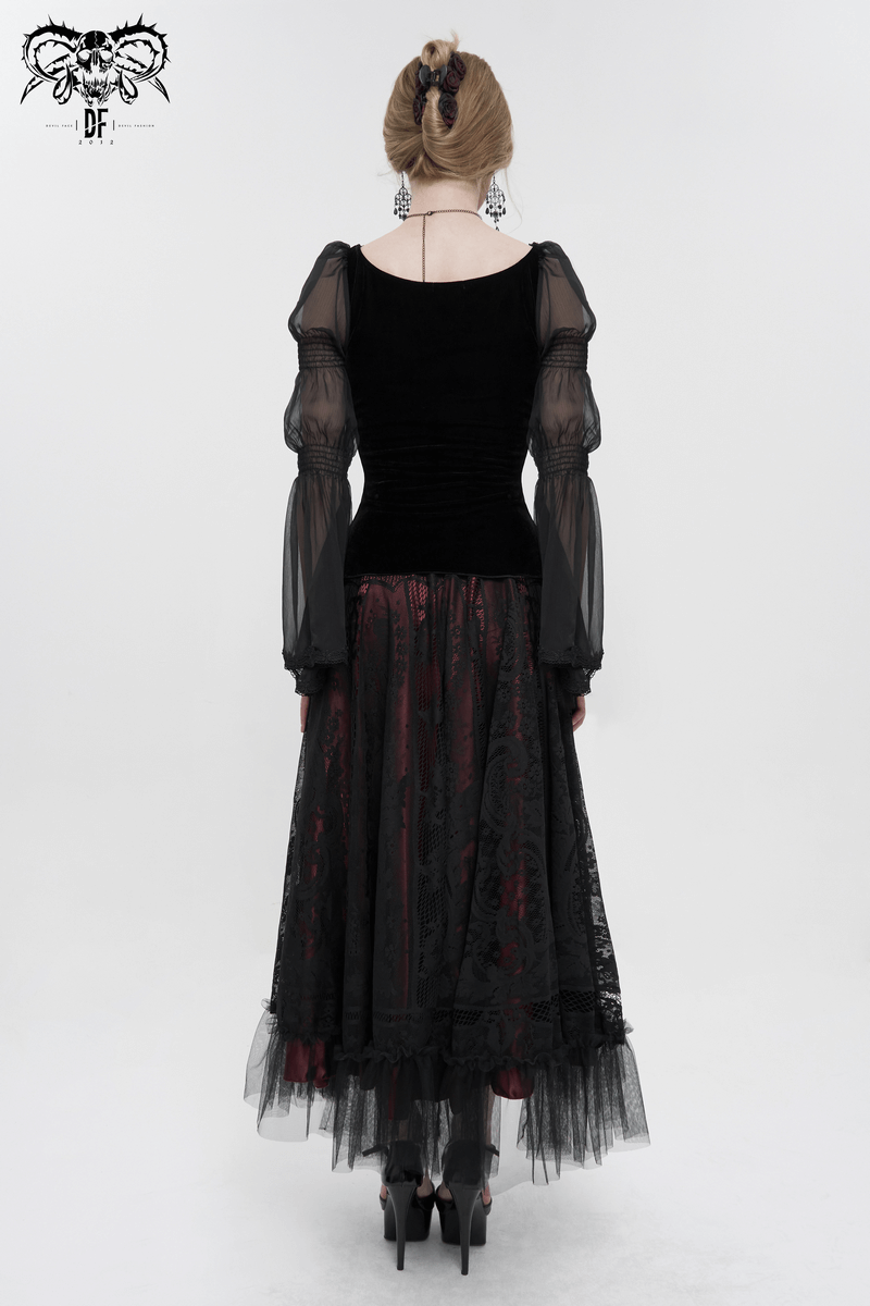 Back view of a gothic black velvet top with transparent long sleeves, paired with a flowing skirt.