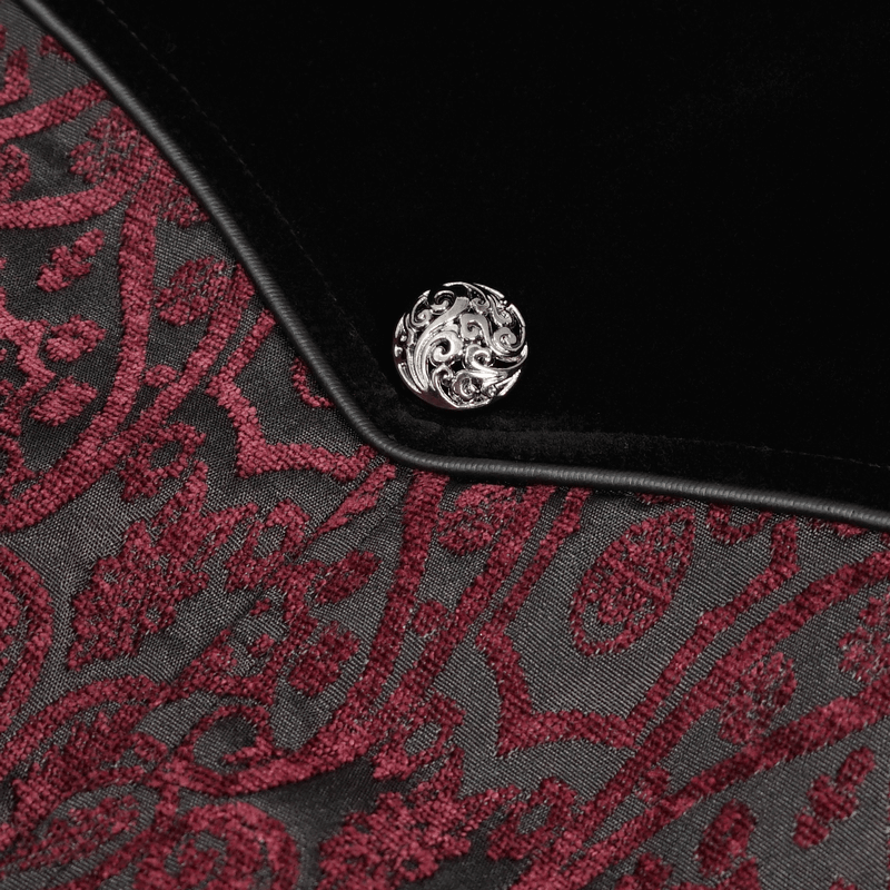 Close-up of gothic wine red and black coat detailing with floral embroidery and ornate button.