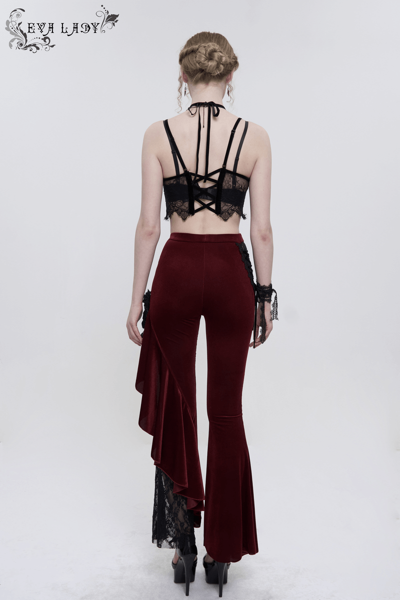 Back view of a model wearing gothic wine red flare trousers with lace-up accents and a lace crop top.