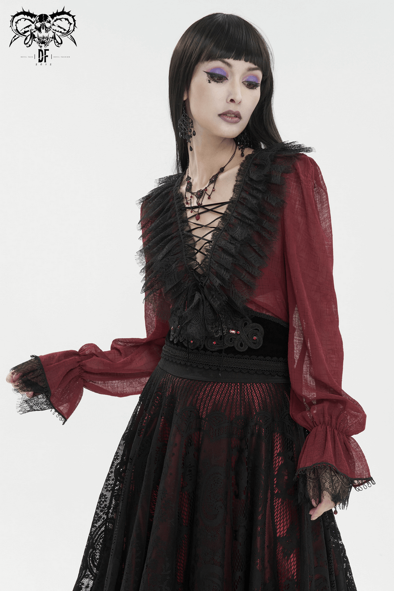 Stylish gothic woman wearing a wine red ruffle top with black lace, showcasing elegance and grace in fashion.