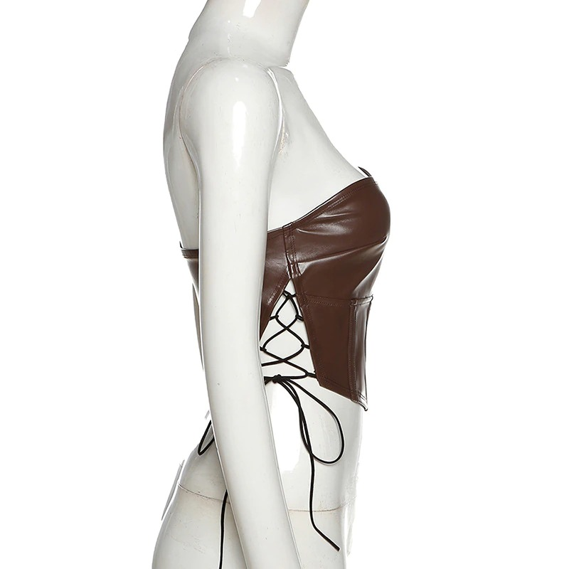 Gothic women black latex crop top with ribbons, sleeveless and backless, showcasing elegant style.