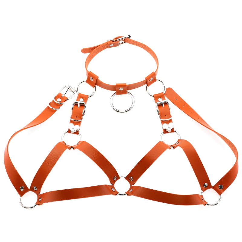 Stylish orange gothic women body harness made of PU leather with silver fittings.