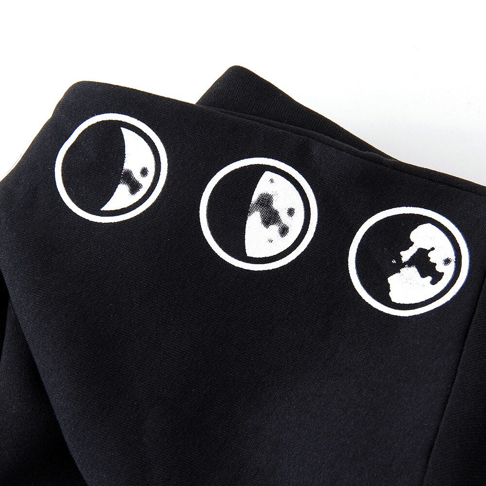 Close-up of moon prints on the black Gothic women's hoodie, showcasing stylish designs on a cozy sweatshirt.