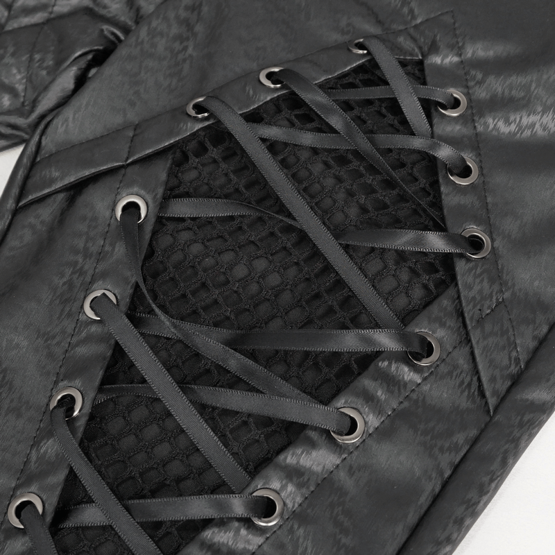 Close-up of gothic women's slim pants with mesh inserts and lace-up detailing in black PU leather.