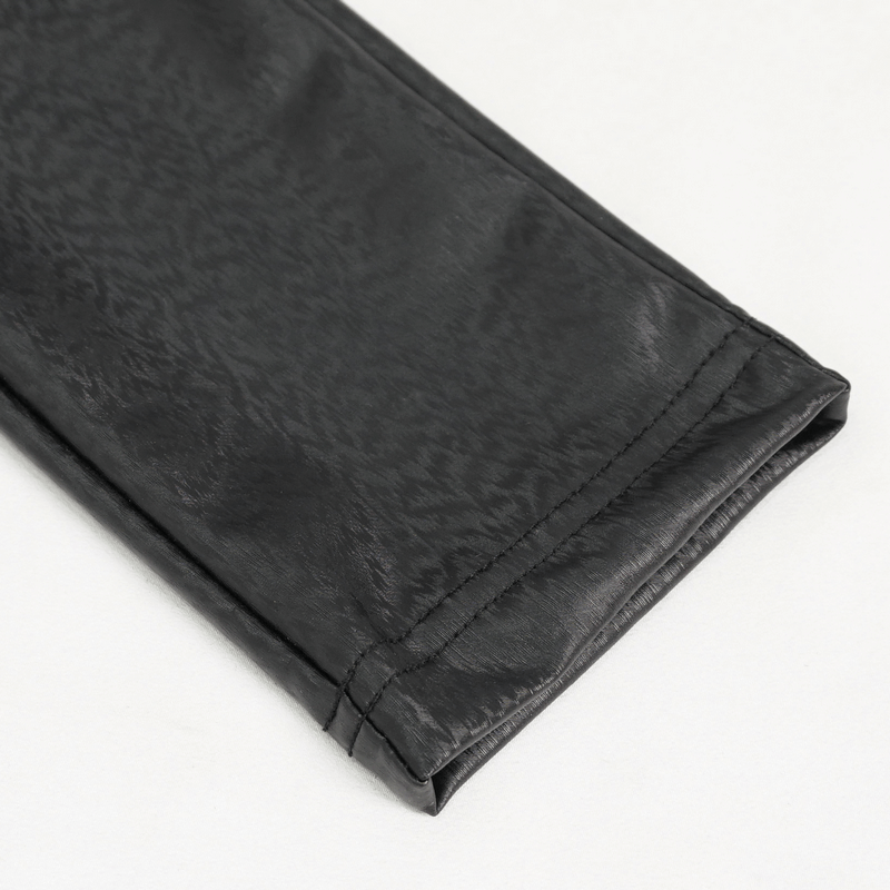 Close-up view of the hem of gothic women's slim pants in black PU leather, showcasing stylish detailing and texture.