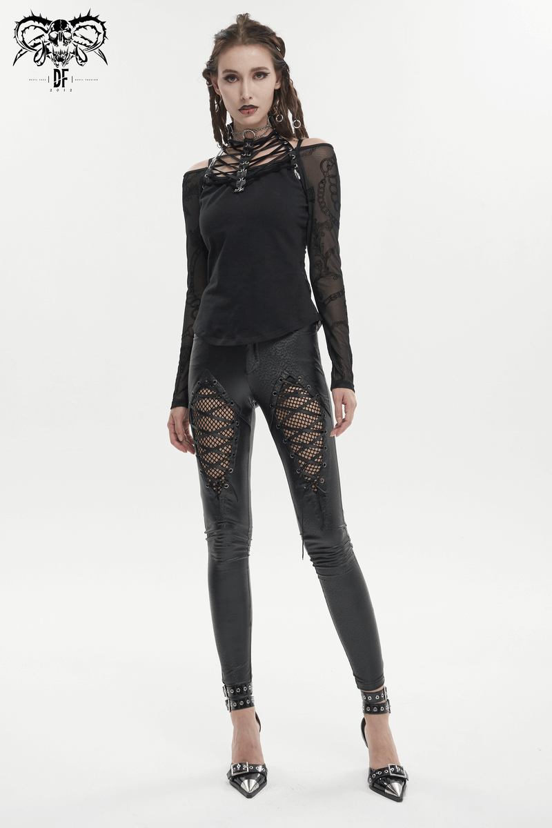 Gothic women's slim pants featuring mesh inserts and lace-up front, paired with a chic black top and stylish heels.